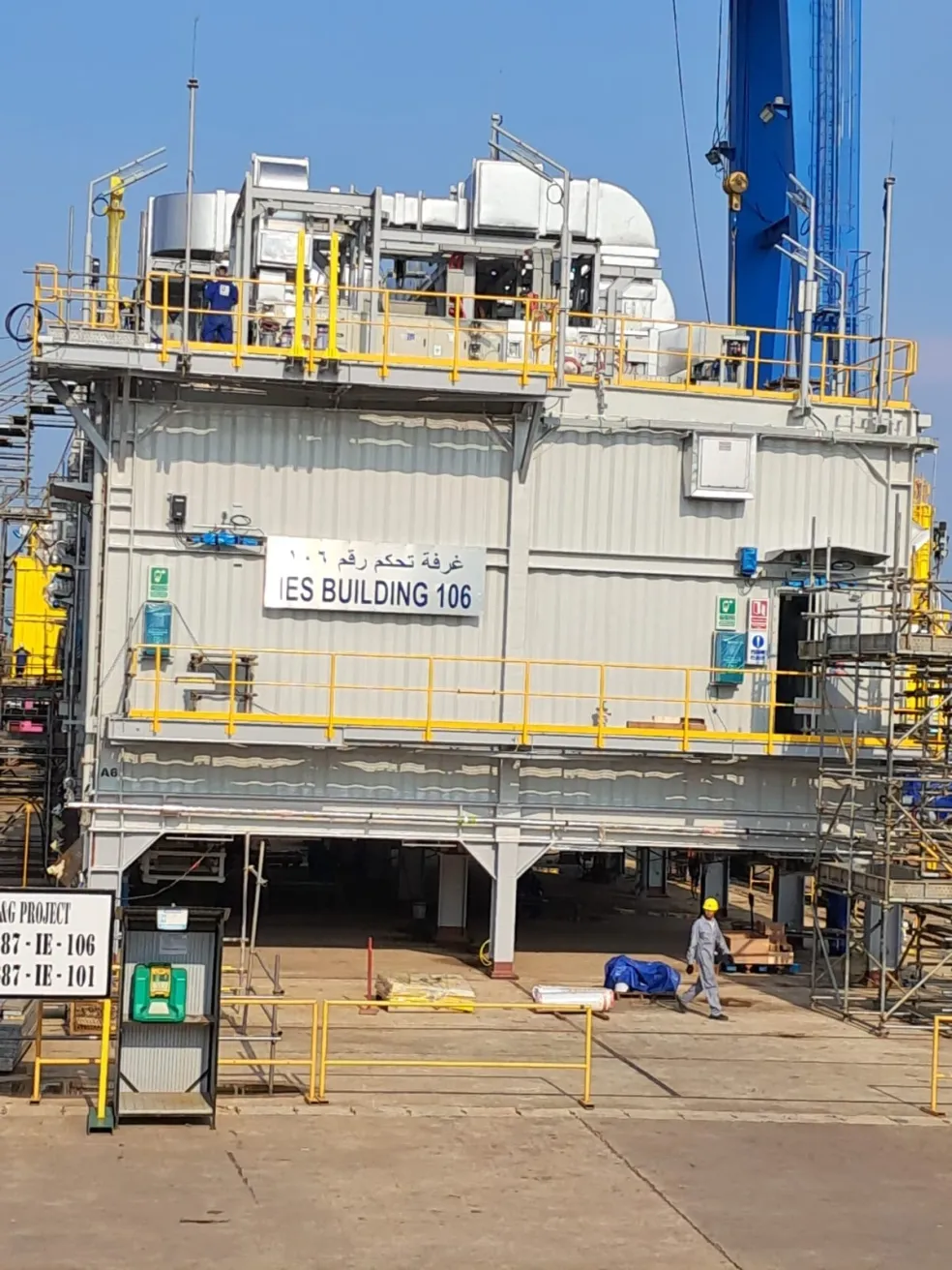 Pioneer Offshore Solutions welder in orange coveralls fabricating stainless steel piping at the Batam yard